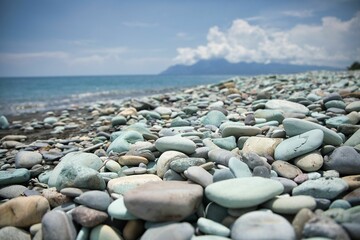 Close-up of blue stones on the beach of Pantai Batu Biru, the Blue Stone Beach, in Ende on Flores.