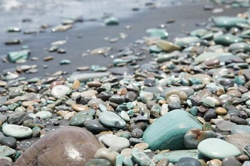 Close-up of blue stones on the beach of Pantai Batu Biru, the Blue Stone Beach, in Ende on Flores.