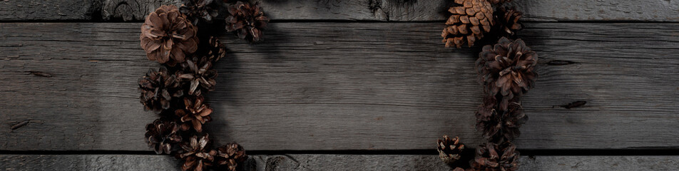 Christmas Pine Cone on Wooden Rustic Background. Christmas Eve and New Year Thematic Mockup Wallpaper for Clipart.