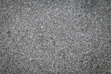 A gray scaled stone floor is used as a background.