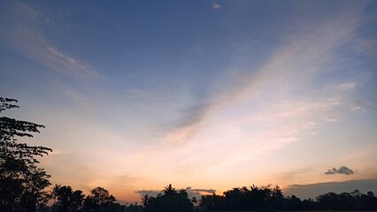 Landscape of the sun sets in the sky in bright blue and reddish red
