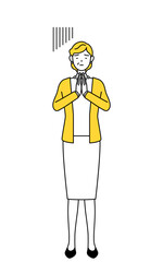 体の前で手を合わせて謝る定年退職したシニア・中年女性