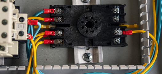 Electrical panel with contactors and wires close-up. Selective focus.