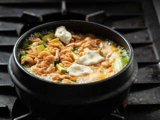 Stew boiling in an earthenware pot	