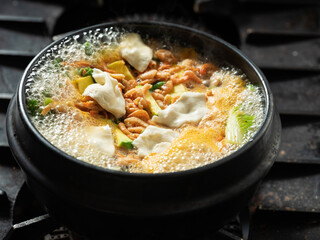 Stew boiling in an earthenware pot