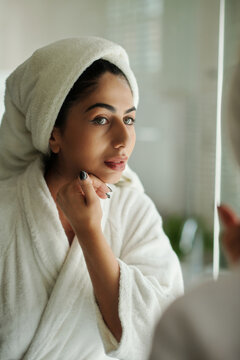 Young Woman Touching Her Smooth Skin After Taking Morning Shower