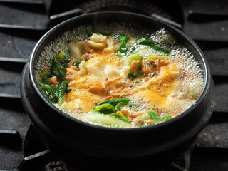 Stew boiling in an earthenware pot	