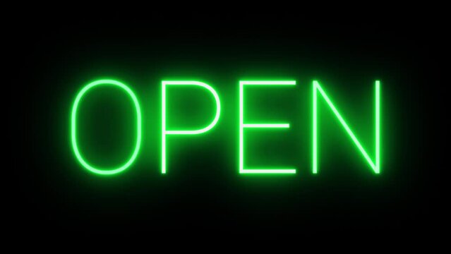 Flickering neon green glowing open sign illuminated black background