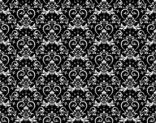 Wallpaper in the style of Baroque. Seamless vector background. White and black floral ornament. Graphic pattern for fabric, wallpaper, packaging. Ornate Damask flower ornament