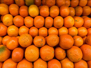 Fresh oranges on fruit market, close up. Boxes full of ripe oranges for sale on farmers market....