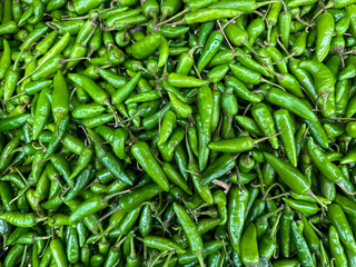 Fresh Green Chilies - Close up Top view at Fresh Market. Very spicy hot Hari Mirchi or Thai Green Chilies