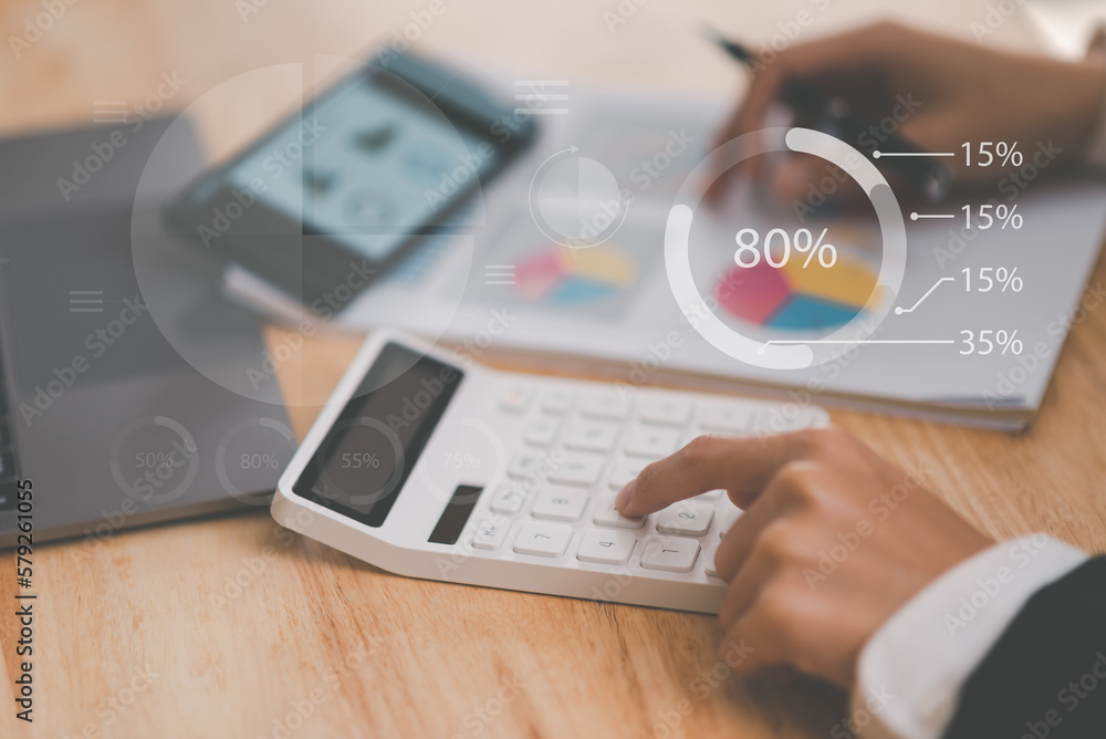 Aufkleber small entrepreneurs calculating figures in company financial documents with a calculator,analysis of