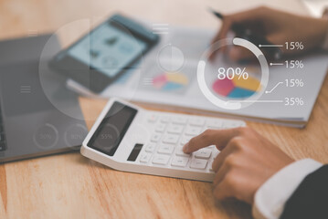 small entrepreneurs calculating figures in company financial documents with a calculator,analysis of company financial data,Planning to assess and review budgets,concept of finance and investment
