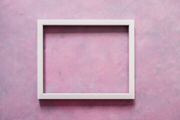 Fototapeta premium white rectangular picture frame mock-up with copy space for yout text or image on top of pink background