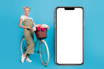 Full size photo of nice blond lady with bicyle near promo wear t-shirt overall sneakers isolated on blue background