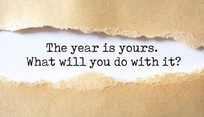 'The year is yours. What will you do with it?' written under torn paper.