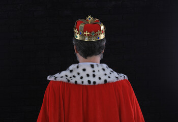 medieval king back on black background