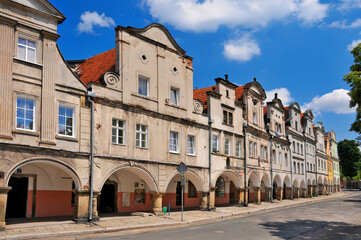 Fototapeta na wymiar Baroque and classicist tenements at the market square in village Chelmno Slaskie, Lower Silesian voivodeship, Poland.