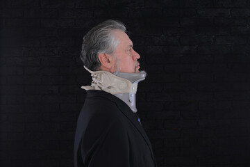 old man with medical neck brace