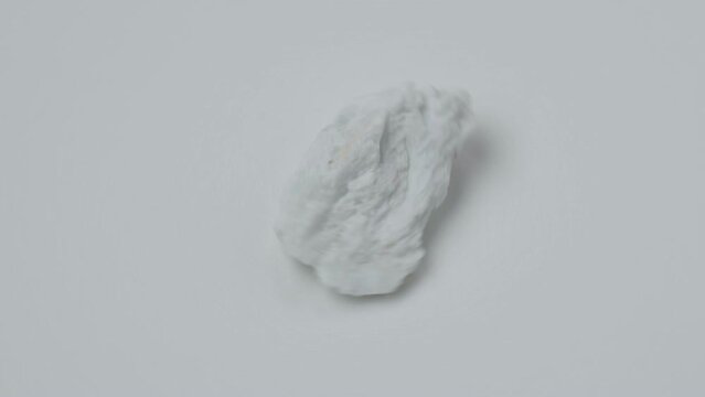 Albite crystal mineral, white background close up. Lepidolite