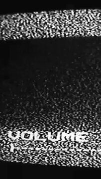 Vertical video. TV glitch. Volume control. Black white real analog grain static noise audio signal error on old television display dark abstract background.