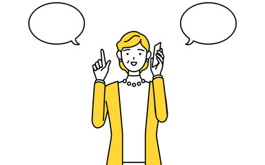 電話をしながら指さしをする定年退職したシニア・中年女性