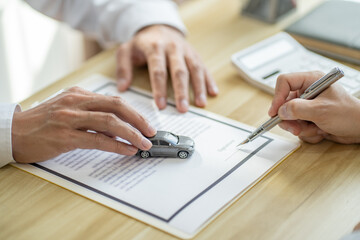 Loss Adjuster Insurance Agent Inspecting Damaged Car. .Sales manager giving advice application form document considering mortgage loan offer for car  insurance