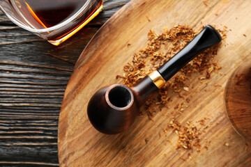 Concept of relaxing, smoking pipe, close up
