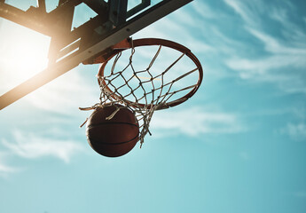 Below, basketball and net with sky in summer for shooting, scoring and points to win game. Hoop,...