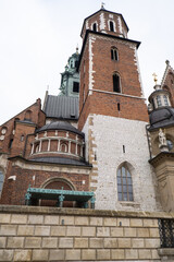 Royal Wawel royal castle in Krakow in rainy early spring weather in Poland. historic castle in the old city Gardens and cathedra, Cracow, Poland. Travel attraction tourist destination