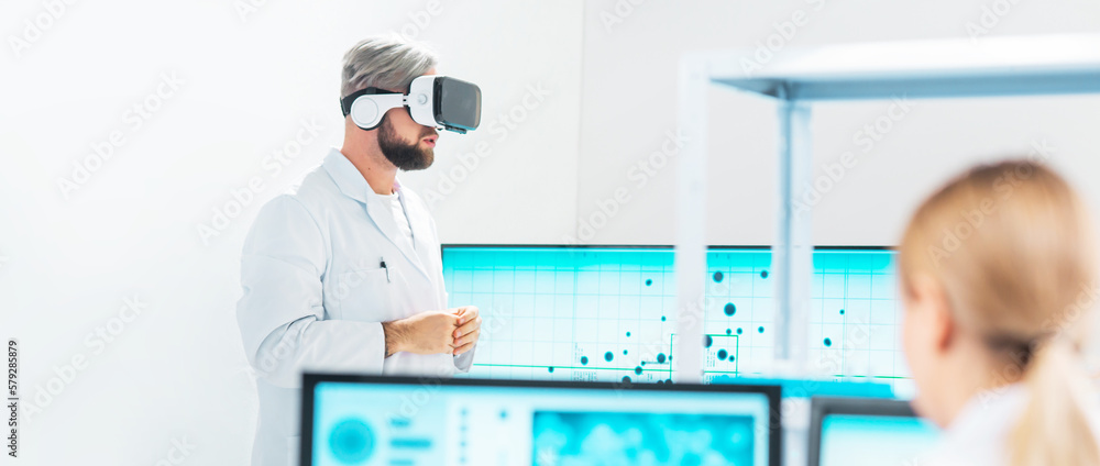 Wall mural Genetic engineers are using Virtual Reality technology. Professional team of scientists is working on a vaccine in a modern scientific research laboratory. Science of future.