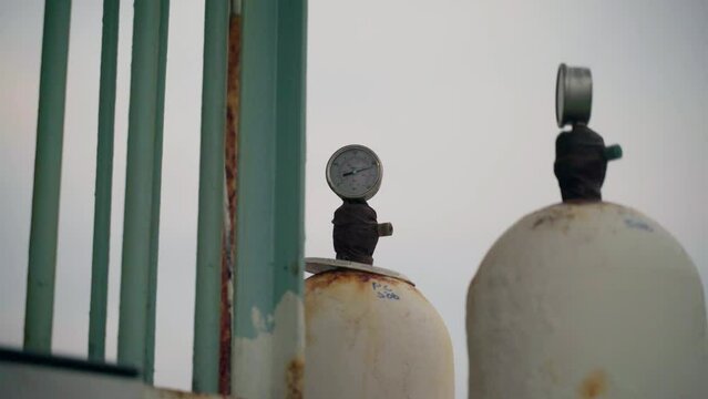 Air and gas pressure tanks with surface rust on a ferry