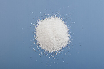 Obraz na płótnie Canvas Pile of Sodium benzoate powder, C6H5COONa. Sodium salt of benzoic acid. Food additive E211. Food Preservative strong depressing effect on yeast and mold fungi