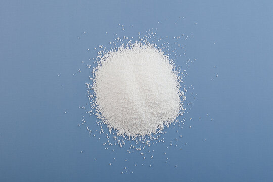 Pile of Sodium benzoate powder, C6H5COONa. Sodium salt of benzoic acid. Food additive E211. Food Preservative strong depressing effect on yeast and mold fungi