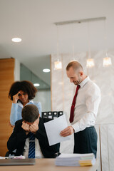 Team thinking of problem solution at office meeting, sad diverse business people group shocked by bad news, upset colleagues in panic after company bankruptcy concept