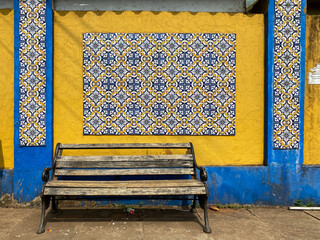 Colorful vintage Portuguese era mosaic tiles on a wall in the Goan town of Candolim.