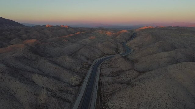 Aerial View Of Sunset On Horizon Over RCD Road Through Remote Balochistan Dramatic Landscape