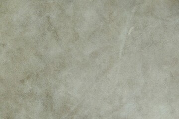 Beige suede cut as background textured and wallpaper. Rustic style leather