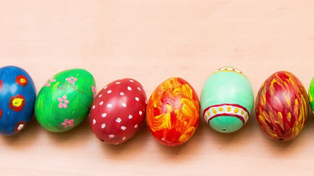 Easter background with handmade colored eggs. Top view. Festive tradition