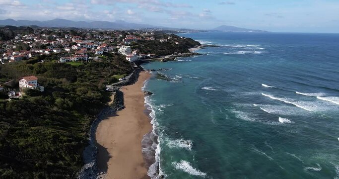 View of the French Basque Country Coastline from Bidart Parlamentia Surf Break to Guethary and all the way to Spain with waves breaking below and mountains in the background