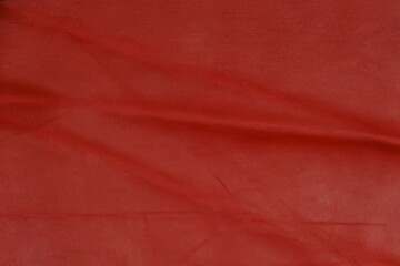 Red leather cut as background textured and wallpaper. Rustic style