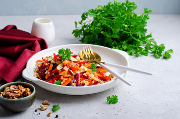 Beetroot Salad with Carrot, Pumpkin, Green Buckwheat Sprouts, Nuts, and Raisins, Healthy Vegan Food
