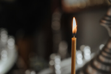 lit candles in the temple close-up