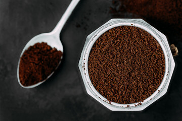 Ground coffee. Coffee moka pot make on dark background
