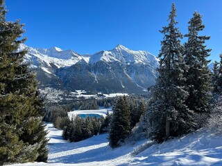 A fairytale winter atmosphere and a magnificent panorama on the mountine tourist resorts of Valbella and Lenzerheide in the Swiss Alps - Canton of Grisons, Switzerland (Schweiz)