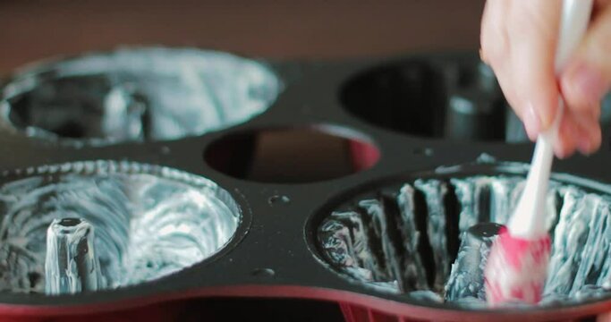 quartet cupcake tins greased, close up