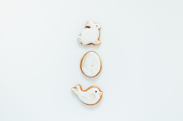 Easter gingerbread in the shape of a bird and a rabbit on a white background. High quality photo. space for text. banner