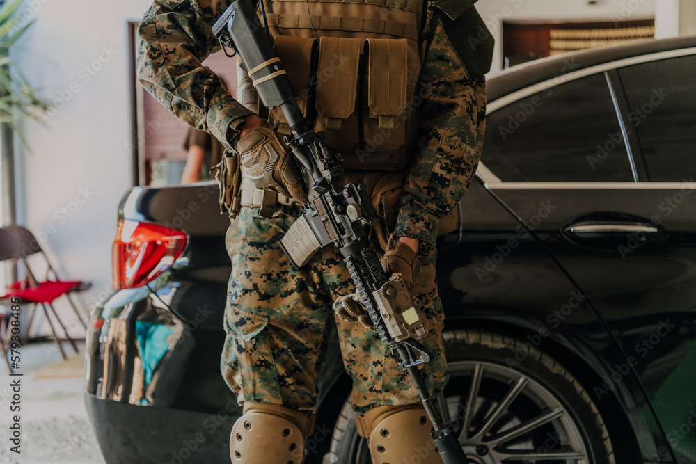 Wall mural American marine corps special operations soldier preparing tactical and commpunication gear for action battle closeup