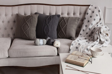 Soft comfortable stylish beautiful knitted pillows, book and balls of thread