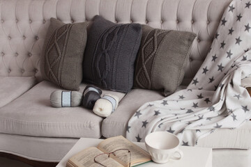 Soft comfortable stylish beautiful knitted pillows, book and balls of thread